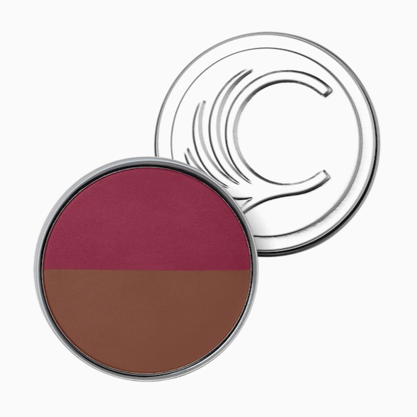 Cheekbone Beautys Blush & Bronzer Duo comes in a round compact with a clear lid featuring a curved embossed design. Inside, talc-free pressed powder pairs a deep berry vegan blush with a warm brown bronzer.
