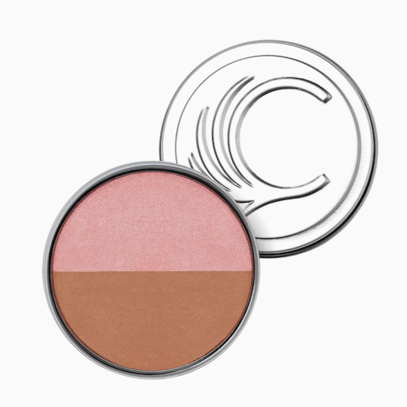 The Cheekbone Beauty Blush & Bronzer Duo features a round compact with a clear lid, showcasing talc-free pressed powder: pink vegan blush on top and brown bronzer on the bottom.