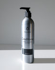 A silver Fillaree Conditioner bottle with a black pump sits on a white surface, casting a shadow. The label reads Natural Hair Relief, All Types, Unscented.