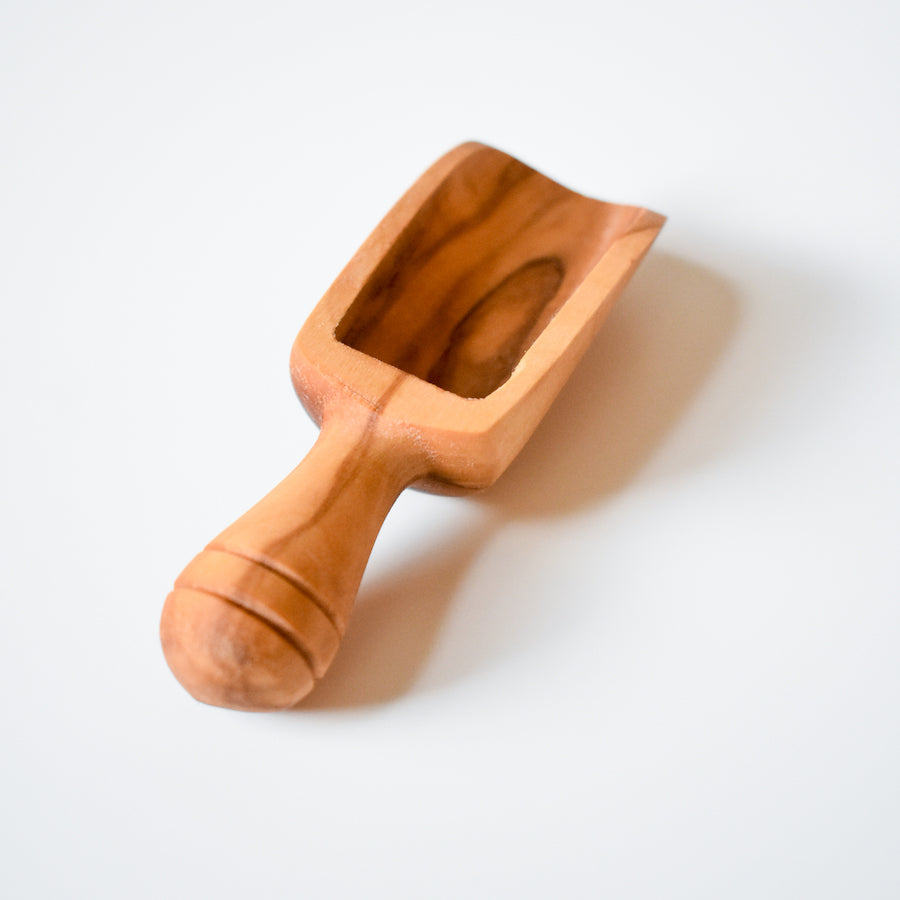 The Vesper & Vine Wood Scoop features a small, rectangular bowl and rounded handle, shown on a plain white background.