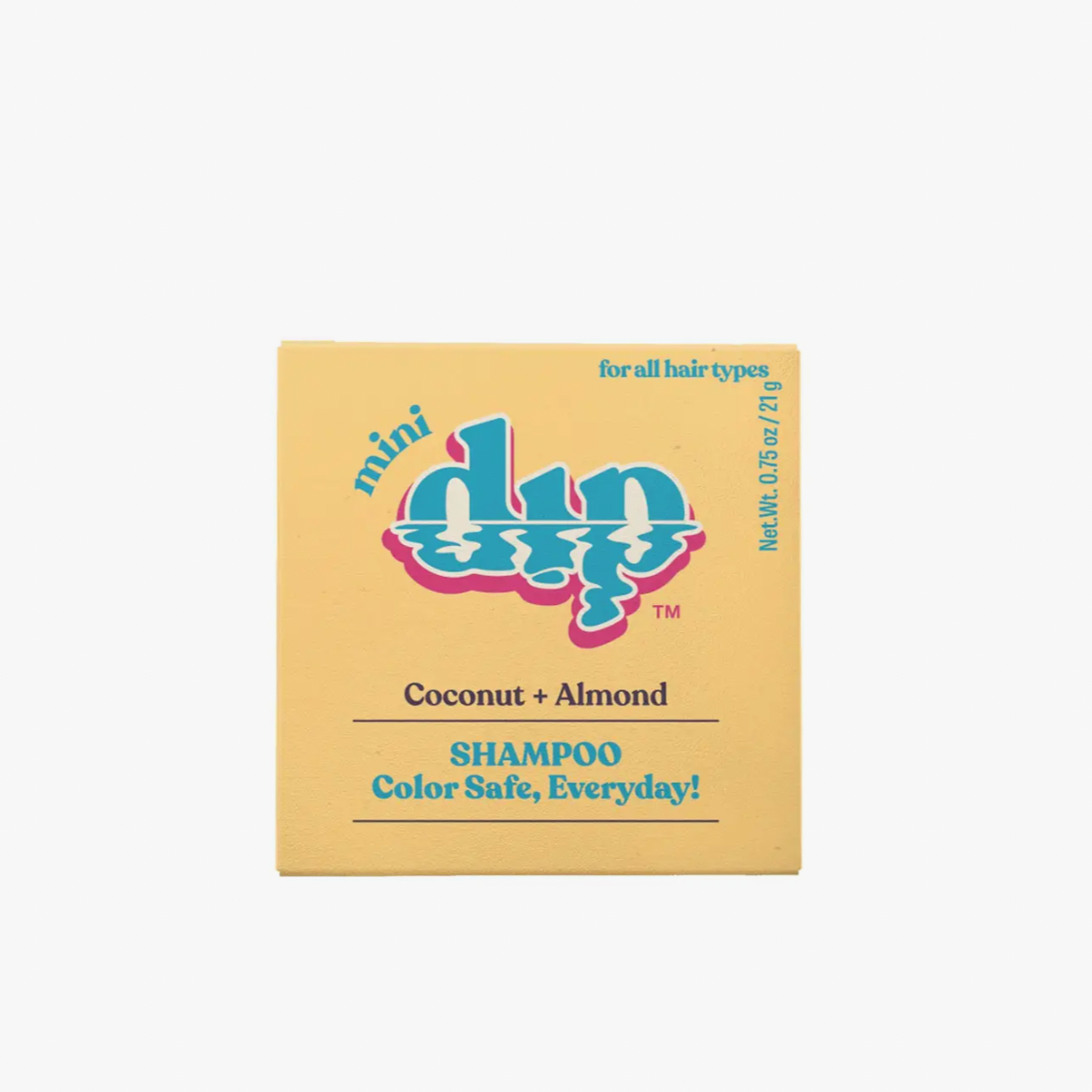 The Dip Shampoo Bar Mini by Dip comes in a yellow square box labeled “mini dip” and contains a 0.75 oz (21g) coconut and almond shampoo bar for all hair types. Its color safe, travel-friendly, and perfect for color-treated hair.