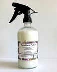 Furniture polish spray bottle with a label on a white background