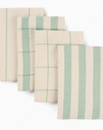 Set of four striped towels with green and beige patterns on a white background