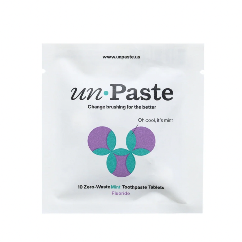 white package of un paste 10 zero waste mint toothpaste tablets with fluoride on white background.