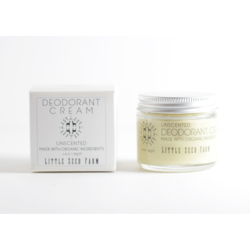 A jar of Little Seed Farm Deodorant Cream sits beside its box, both featuring a minimalist white and gray design labeled Made with Organic Ingredients. This plastic-free, handmade in Tennessee deodorant offers a natural choice.