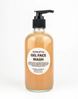 A clear bottle with a black pump, labeled Zerra & Co. Gel Face Wash, contains orange gel and ingredient details on the front—ideal for fragrance-free skincare routines.