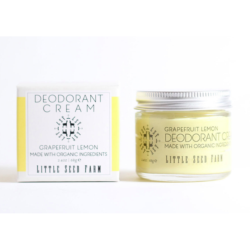 A jar and box of Little Seed Farm Deodorant Cream in grapefruit lemon are pictured. This plastic-free, handmade deodorant features white packaging with yellow accents, black text, and organic ingredients. Made in Tennessee.