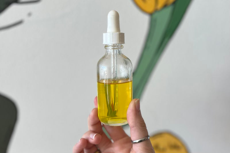 glass bottle of skin oil 