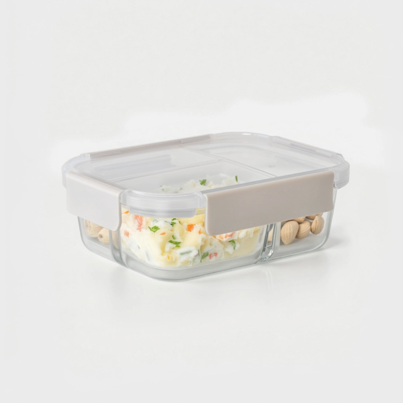 Glass food storage container with a gray lid on a white background