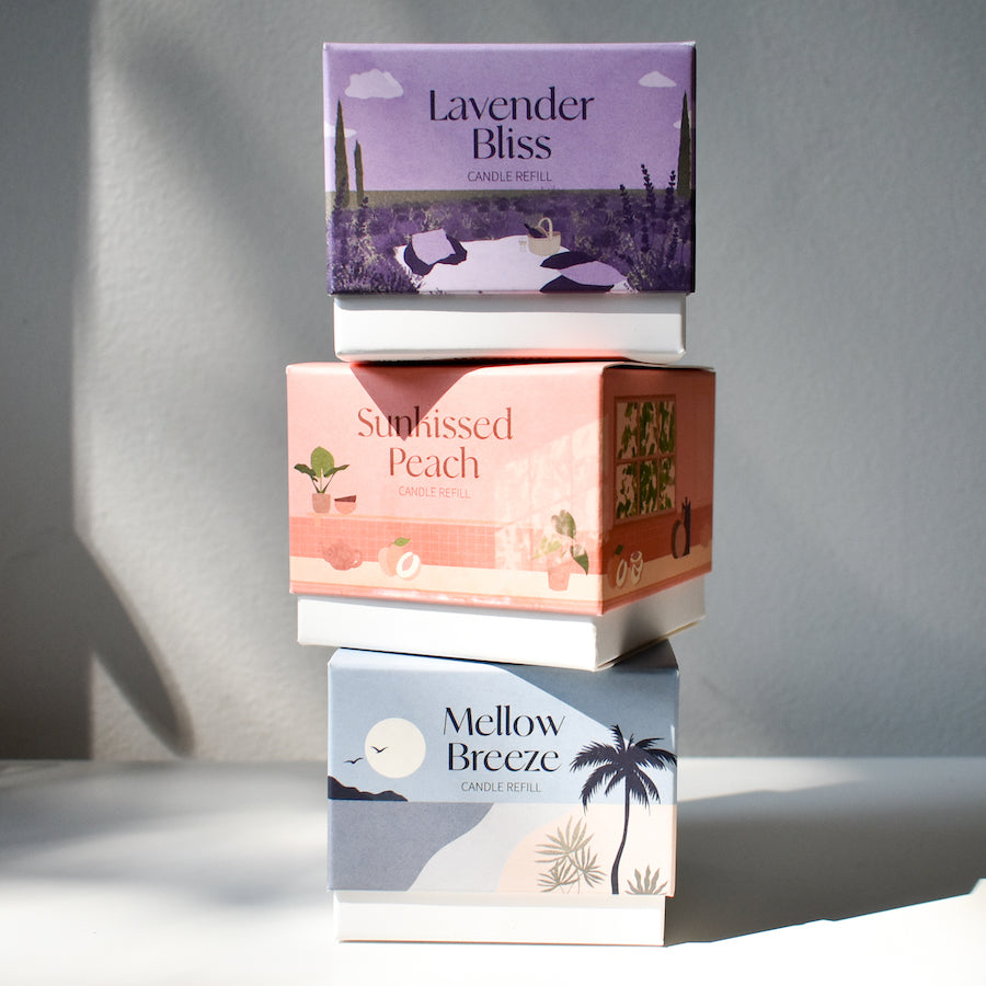 A stack of the Arbor Made candle refills in their boxes.