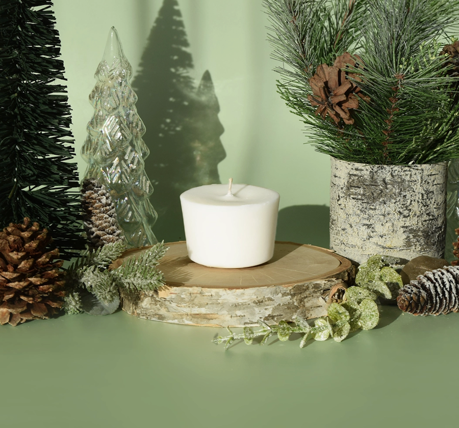 wax candle refill glacial pine scent on green backdrop with pine decor