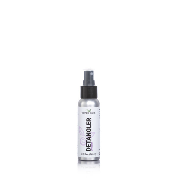 A silver bottle of a simple planet's plant based biodegradable detangler spray. It has a black top and a white and purple label. 