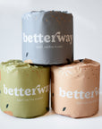 Stack of Toilet Paper wrapped in paper that says Betterway