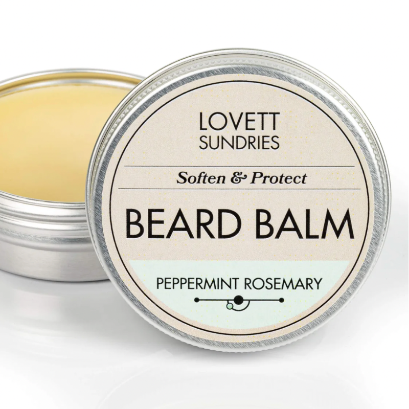 Beard balm container with 'Lovett Sundries' branding on a white background