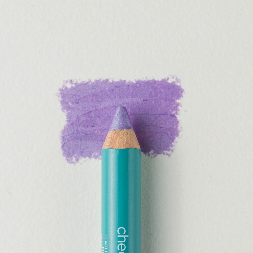 A close up on the Cheekbone Beauty vegan mini eyeshadow pencil and a swatch behind the pencil tip. This is the shade lavender rock, a vibrant purple with light shimmer. 