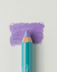 A close up on the Cheekbone Beauty vegan mini eyeshadow pencil and a swatch behind the pencil tip. This is the shade lavender rock, a vibrant purple with light shimmer. 