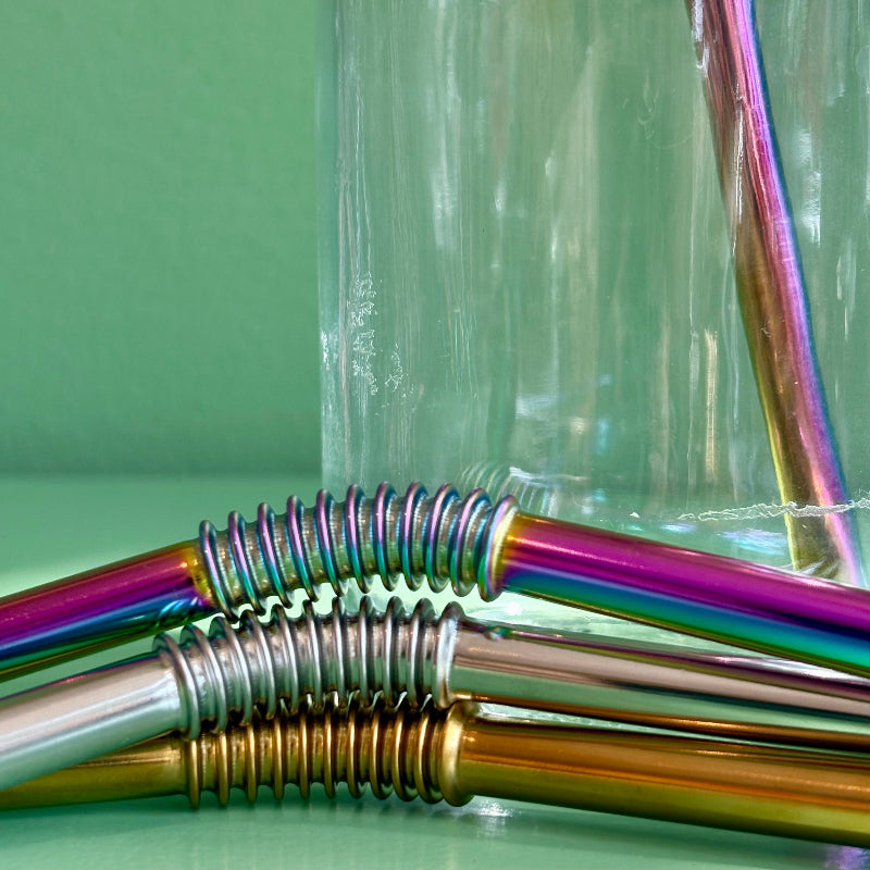 A close up on the bendable section of the reusable bendy metal straw. 