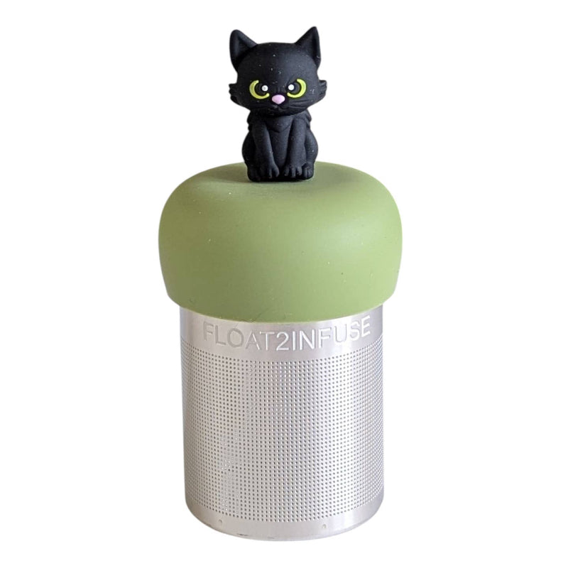 A Stainless steel and silicone floating tea infuser. The top silicone part is green with a cute black cat charm on top of it.