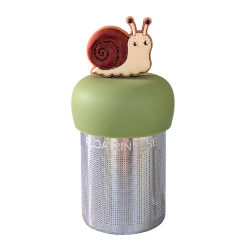 A Stainless steel and silicone floating tea infuser. The top silicone part is green with a cute brown snail charm on top of it.