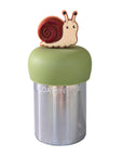 A Stainless steel and silicone floating tea infuser. The top silicone part is green with a cute brown snail charm on top of it.