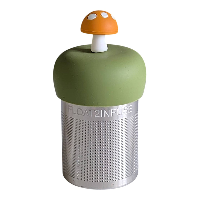 A Stainless steel and silicone floating tea infuser. The top silicone part is green with a cute yellow mushroom charm on top of it.