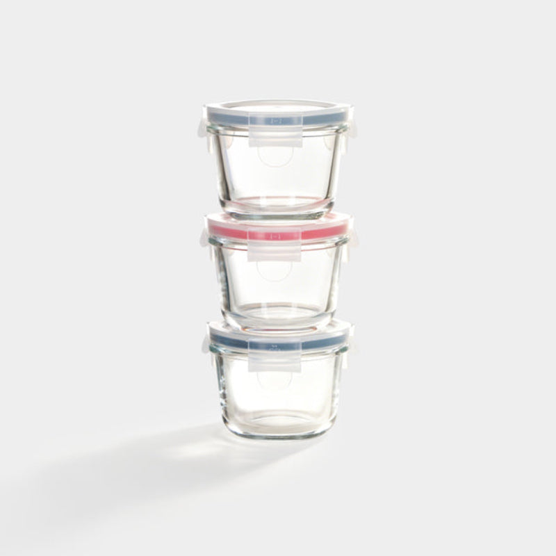 Three borosilicate glass containers in light blue, red, and dark blue stacked on top of each other on a white background. 