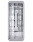 A rectangular metal ice mold tray with multiple compartments and a central handle, shown on a plain white background.