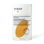 A white paper deodorant tube with a orange oval hibar branding on it in the Bergamot and cedar scent. 