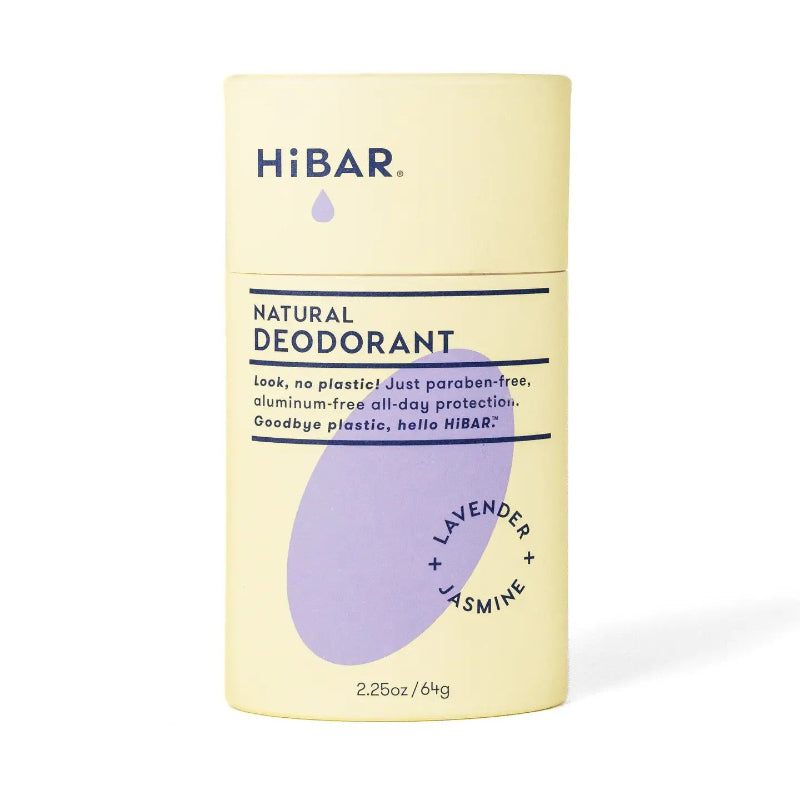 A yellow paper deodorant tube with a purple oval hibar branding on it in the lavender and jasmine scent. 