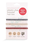 Pack of biodegradable handmade hair ties designed to fit comfortably around your wrist.  Three chevron hair ties wrap around the packaging. One hair ties is Black and white, one is beige and white and one is pink and brown. 