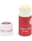 A tube of Candy Cane lip balm in an eco friendly paper tube that is red and white. 
