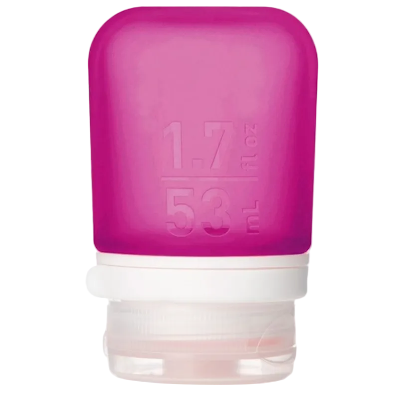 A small 1.7 oz silicone bottle in the color magenta on a white surface. 