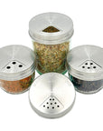 For regular mouth mason jars filled with spices with the stainless steel mason jar spice lids on them. Each one is adjusted to a different opening option showing the large, medium, and small hole options and the pour opening. 