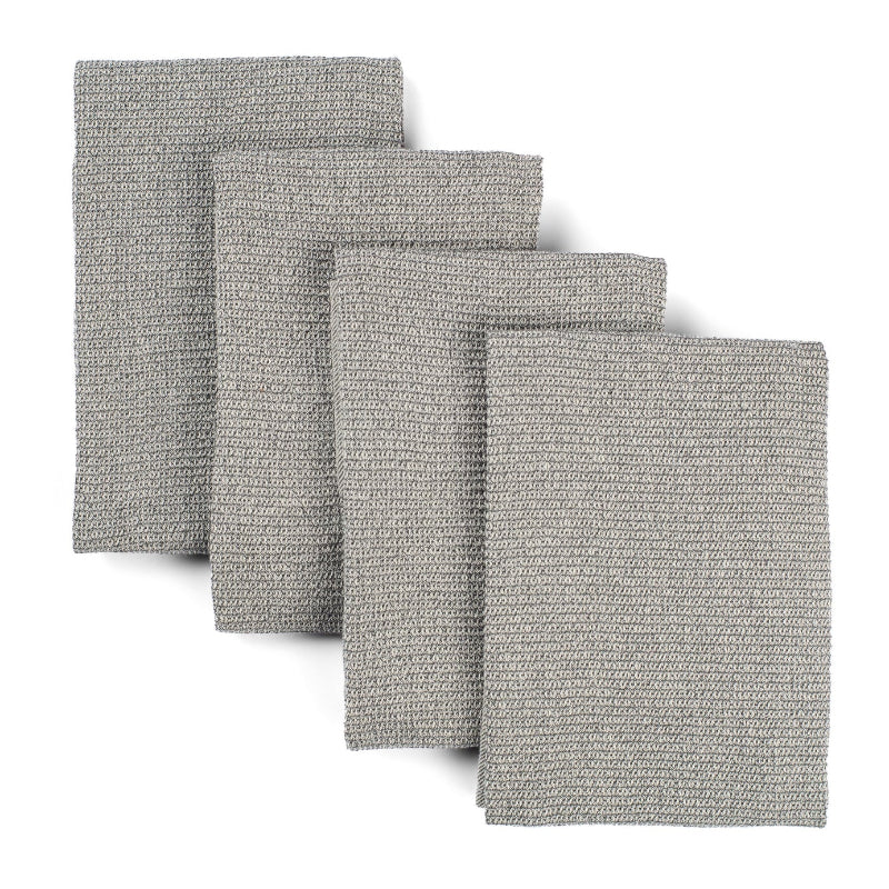 Four grey waffle weave upcycled cotton towels lying on top of each other on a white background. 