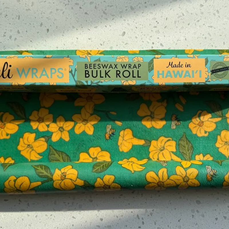 Roll of floral-patterned beeswax wrap with 'ali WRAPS' branding on a light gray background.