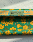 Roll of floral-patterned beeswax wrap with 'ali WRAPS' branding on a light gray background.