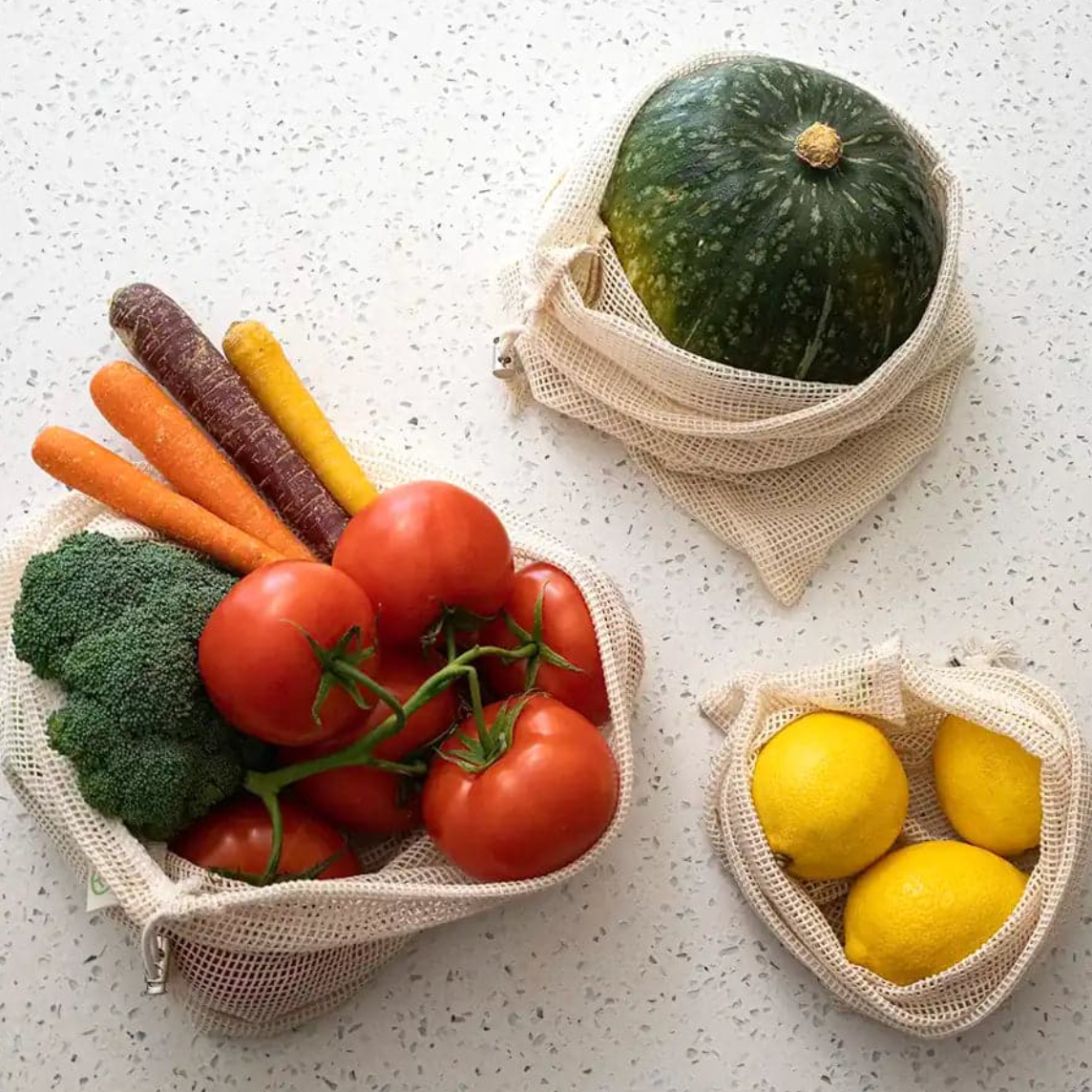 Organic produce in mesh bag on countertop