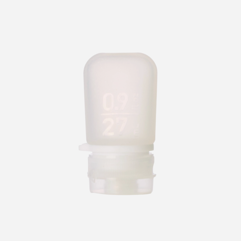 The extra small 0.9 oz silicone squeeze tube in the color clear. 