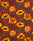No paper towel with yellow and orange sunflowers on a maroon background.