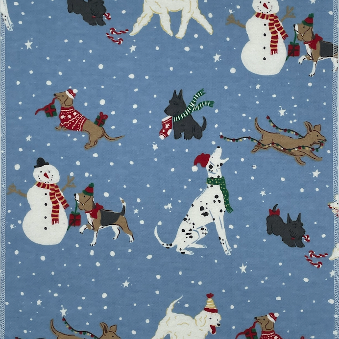 No Paper towel with a variety of dogs wearing scarves and hats in holiday colors  playing in a snow scene with snowmen on a light blue background. 