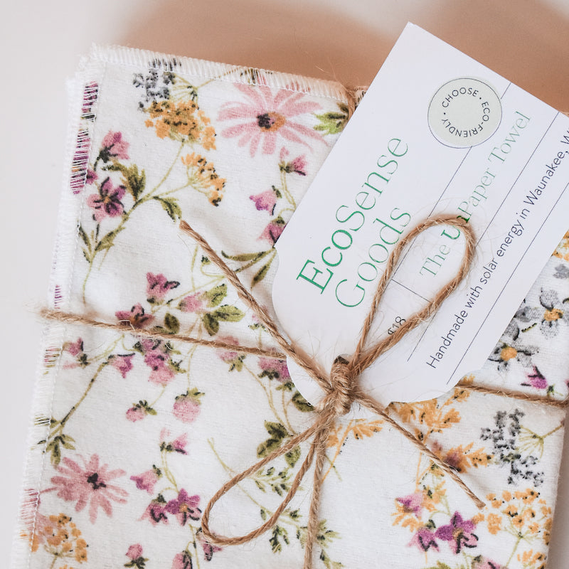 A set of vintage floral no paper towels tied into a bundle with string. 