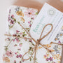 A set of vintage floral no paper towels tied into a bundle with string. 