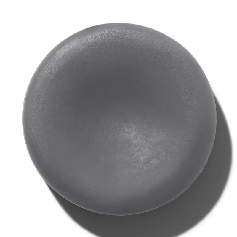 Dark gray ceramic plate on a white background