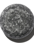 Round stone ball on a white background