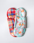 Set of colorful reusable pads on a white background