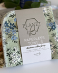A pack of the Floral Sage patterned Paperless towels, featuring white and blue floral illustrations on a green background. 