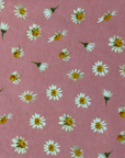 The Pink Daisy Paperless towel pattern featuring white daisies on a pink background.