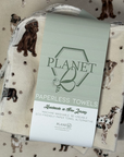 A stack of the Puppy Pals Patterned Paperless towels with the same patterned paperless towel in the background. 