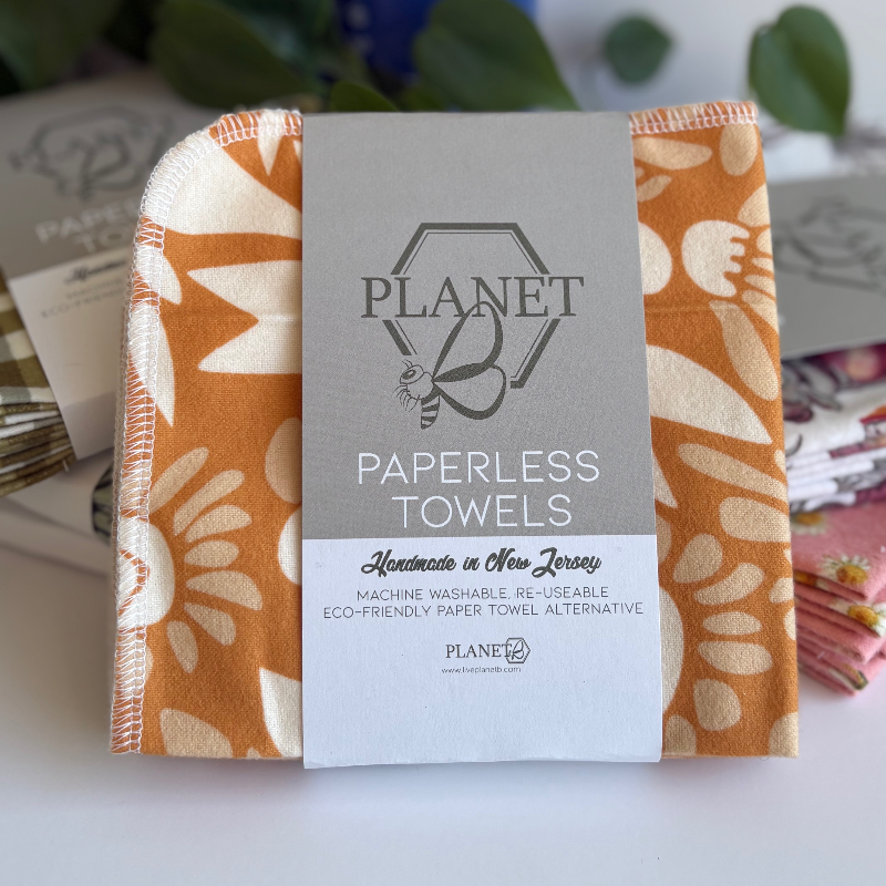 A pack of Planet B paperless towels in the Retro birds and flowers pattern featuring an orange floral design.