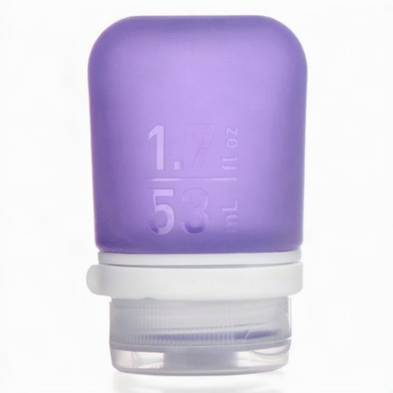 A small 1.7 oz silicone bottle in the color purple on a white surface. 